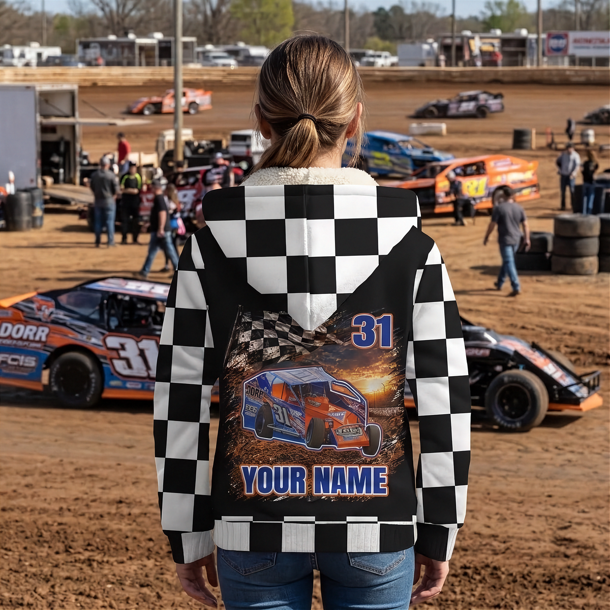 Woman wearing a personalized dirt modified sherpa jacket beside race cars, showing the car photo, number 31, and name design.