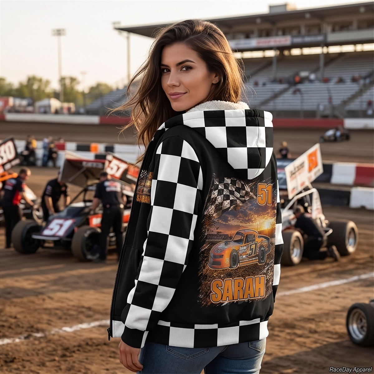 Woman wearing a street stock sherpa jacket with orange car artwork, number 51, and the sample name “SARAH.”
