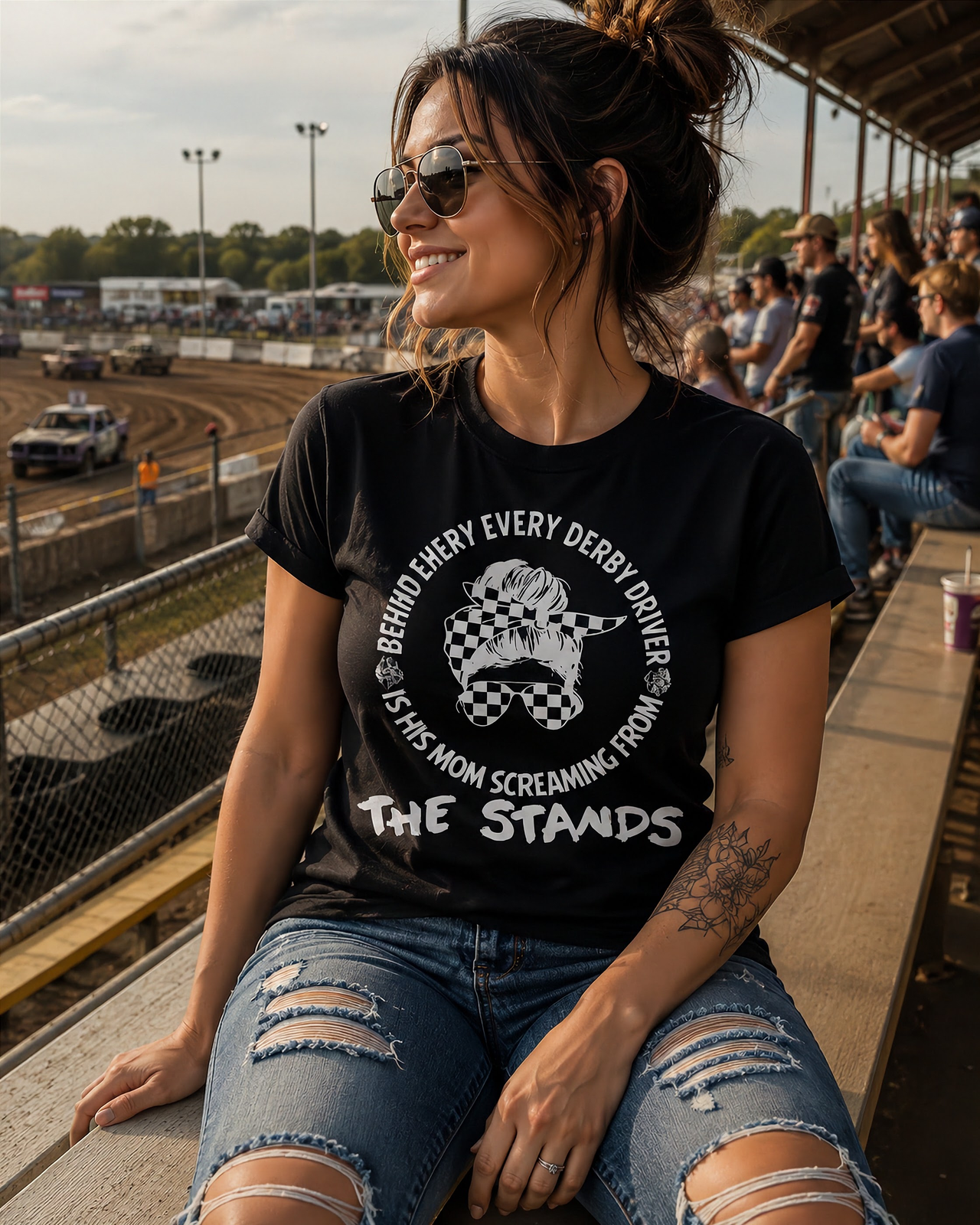 Women's demolition derby apparel featuring the "Behind Every Derby Driver Is His Mom Screaming From The Stands" graphic, available in premium t-shirts, racerback tanks, and warm hoodies.