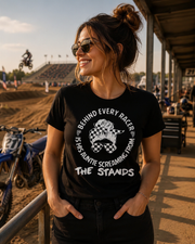 Women's motorsport apparel featuring the bold "Behind Every Racer Is His Auntie Screaming From The Stands" graphic, available in premium t-shirts, tanks, and hoodies.