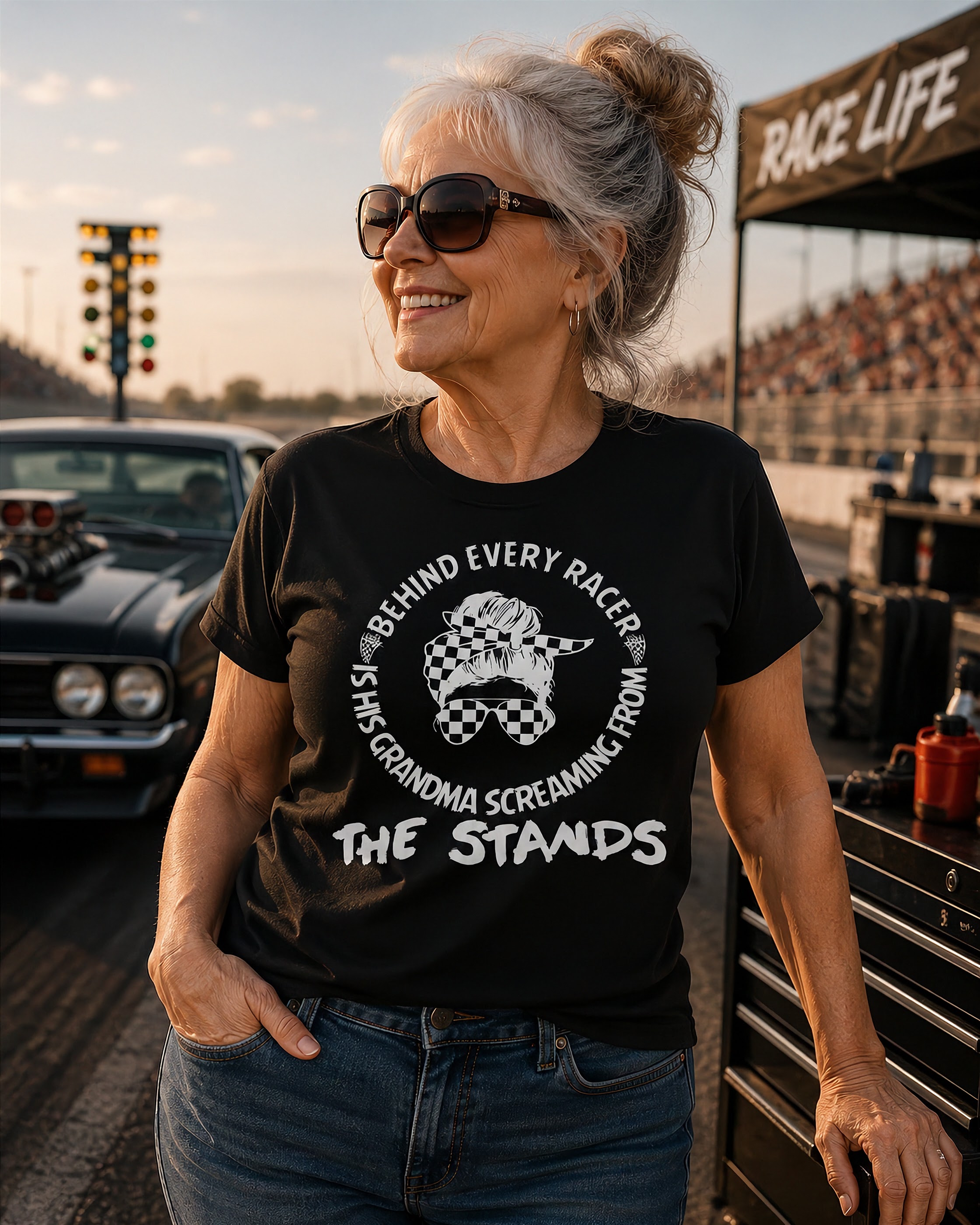 Women's motorsport apparel featuring the bold "Behind Every Racer Is His Grandma Screaming From The Stands" graphic, available in premium t-shirts, tanks, and hoodies.