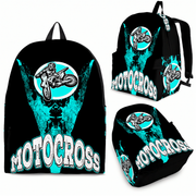 Custom Carolina Blue motocross backpack featuring a dynamic dirt bike rider catching air over a jump, complete with thick padded black ergonomic straps, black zippers, and a front utility pocket isolated on a white background.