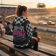 A personalized racing jacket displayed on a mannequin, featuring a large, high-resolution photo of a custom muscle car printed on the back panel, complemented by black and white checkered flag accents on the sleeves and a plush, cream-colored sherpa lining visible at the collar.