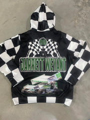 A personalized racing jacket displayed on a mannequin, featuring a large, high-resolution photo of a custom muscle car printed on the back panel, complemented by black and white checkered flag accents on the sleeves and a plush, cream-colored sherpa lining visible at the collar.