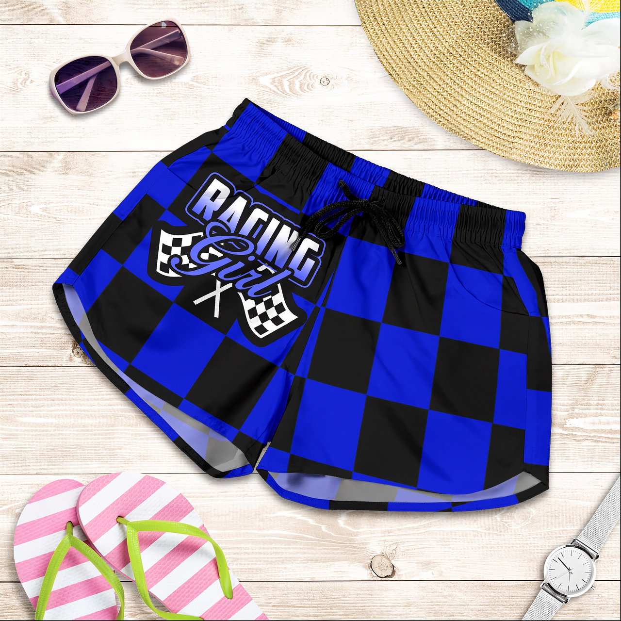 Custom personalized women's blue racing shorts featuring a bold royal blue and black checkerboard flag design for trackside motorsports fans.
