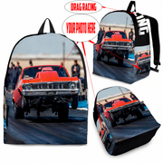 Custom personalized drag racing backpack for kids featuring an orange race car launching at the drag strip for back to school gear.