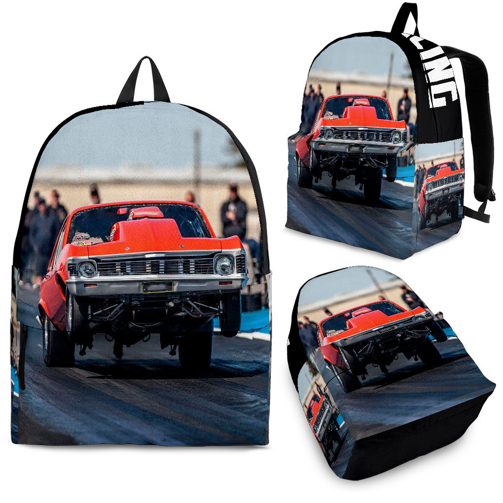 Custom personalized drag racing backpack for kids featuring an orange race car launching at the drag strip for back to school gear.