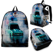 Custom personalized drag racing backpack for kids featuring an orange race car launching at the drag strip for back to school gear.