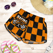 Custom personalized women's orange racing shorts featuring a high-visibility black and orange checkered pattern for trackside motorsports fans.