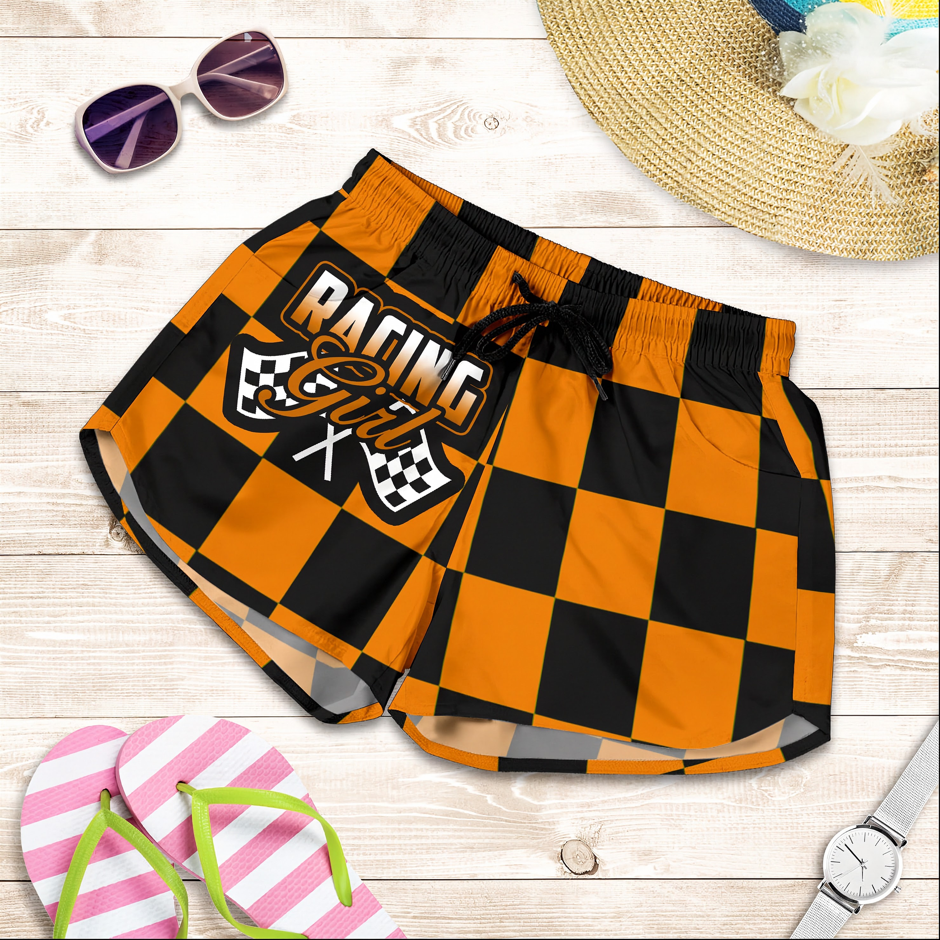 Custom personalized women's orange racing shorts featuring a high-visibility black and orange checkered pattern for trackside motorsports fans.