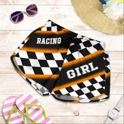 Custom personalized women's orange racing shorts featuring a high-visibility black and orange checkered pattern for trackside motorsports fans.