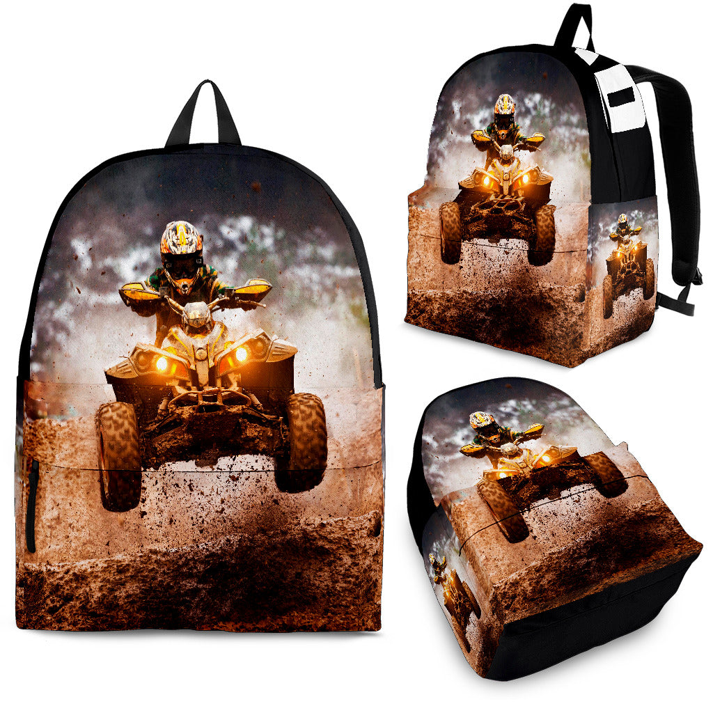 Custom personalized quad ATV backpack for kids featuring an off-road four-wheeler leaping over a muddy jump for back to school gear.