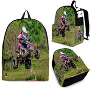 Custom personalized quad ATV backpack for kids featuring an off-road four-wheeler leaping over a muddy jump for back to school gear.