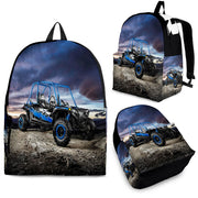 Custom personalized UTV buggy backpack for kids featuring a blue off-road side-by-side vehicle under a dramatic sunset for back to school gear.