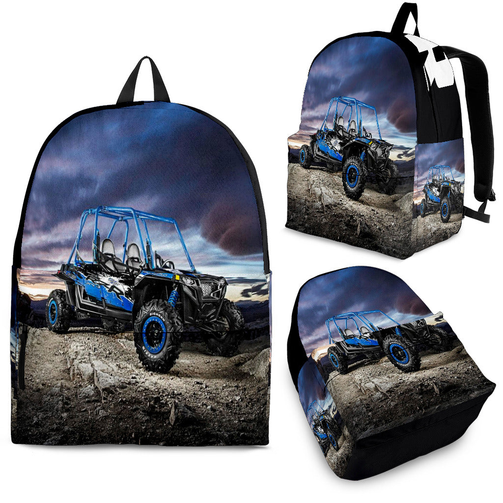 Custom personalized UTV buggy backpack for kids featuring a blue off-road side-by-side vehicle under a dramatic sunset for back to school gear.
