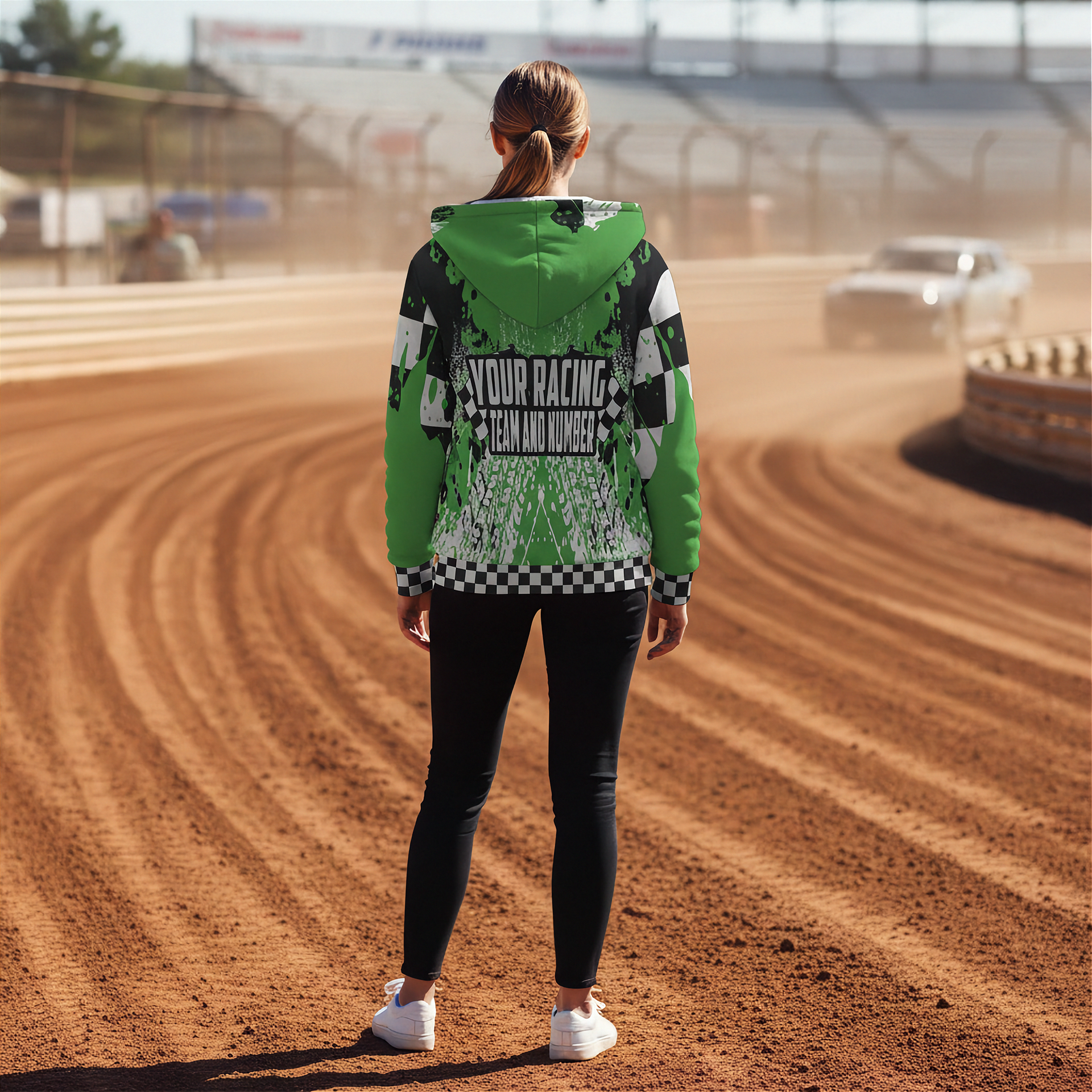 woman wearing a green racing jacket on a dirt track