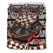 Bedding set with dirt track racing theme featuring a sprint car and checkered flag on a white background.