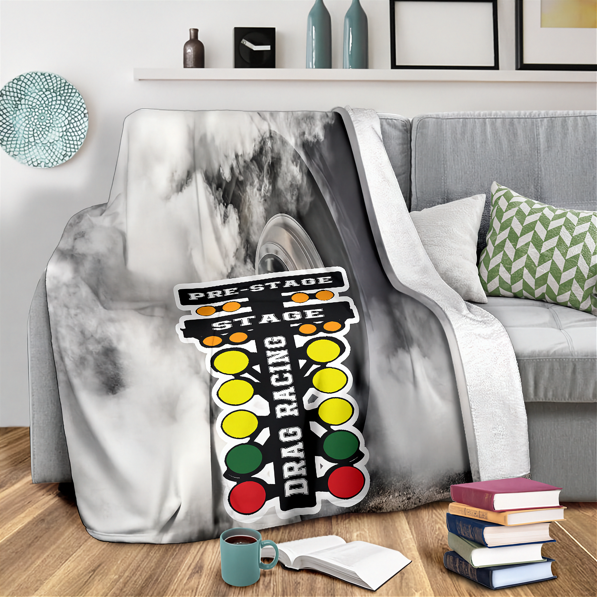 Gray marble-patterned blanket draped over a couch with a colorful 'Drag Racing' sign design.