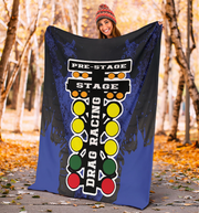 woman in a forest holding a drag racing themed blanket