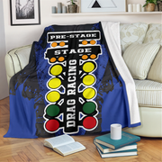 Drag racing themed blanket draped over a chair in a living room setting