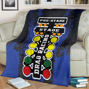 Drag racing themed blanket draped over a couch in a living room setting