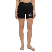 Black athletic shorts with a colorful logo on a white background