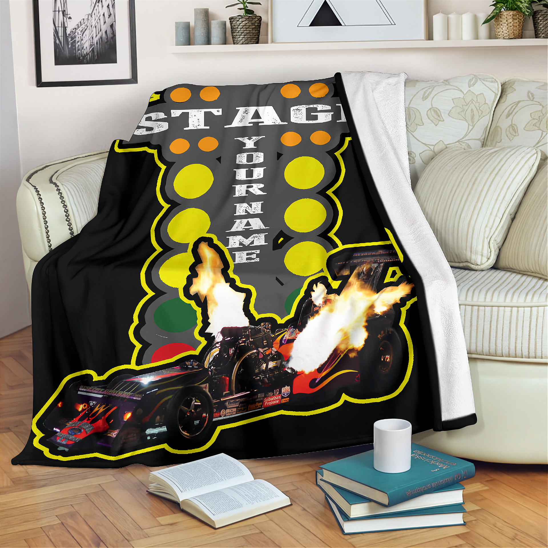 Blanket with a graphic design of a car and text on a couch in a living room.
