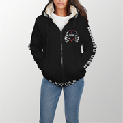 a girl standing wearing a racing girl sherpa jacket with white background