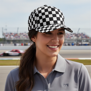 Woman wearing a checkered cap and gray polo shirt on a race track