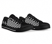 Black sneakers with white checkered pattern on a white background