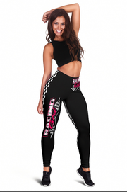 Woman wearing black leggings with racing graphics on a white background