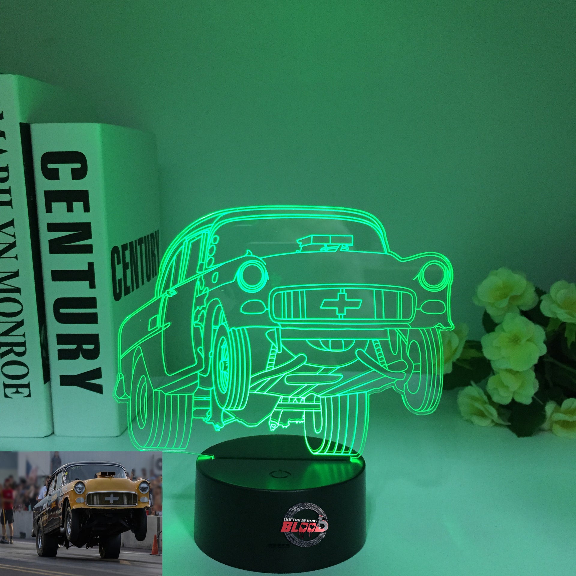 1955 Chevy 3D LED Illusion Lamp showing the classic Tri-Five silhouette in a vibrant teal glow on a premium black base.