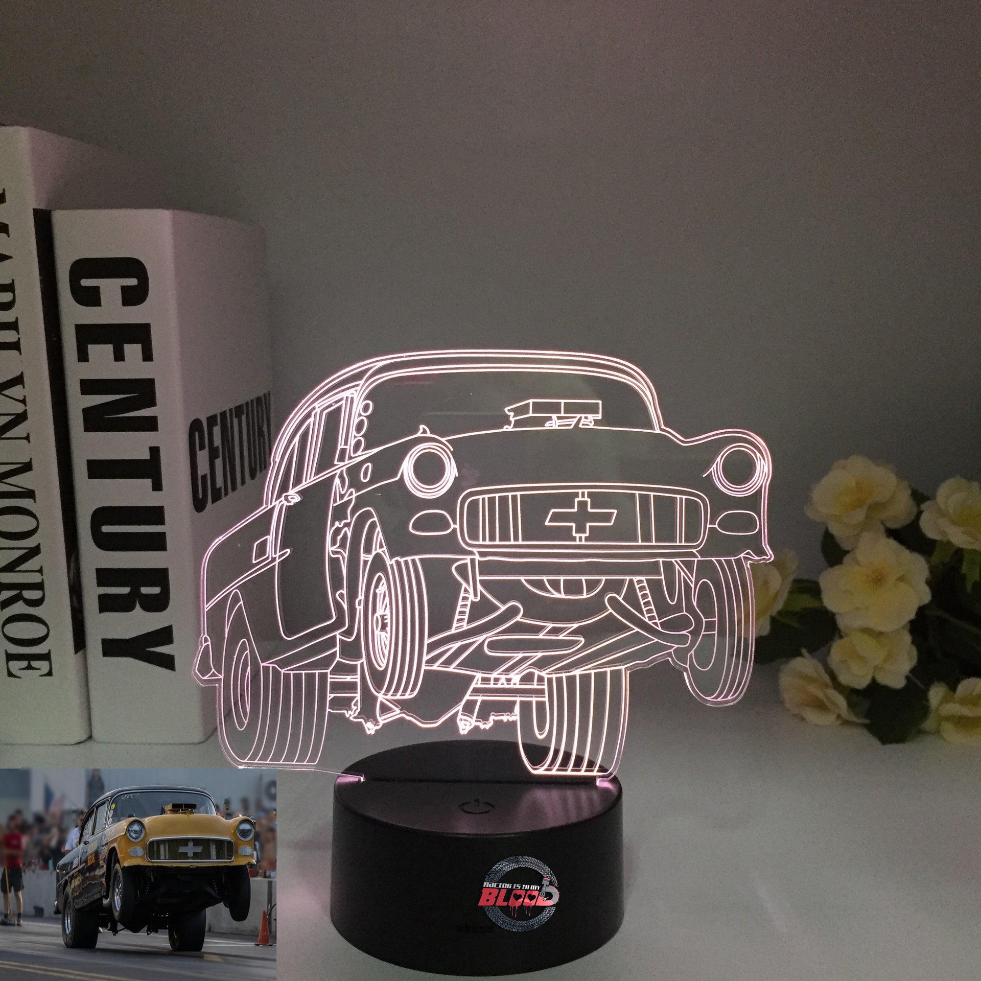 1955 Chevy 3D LED Illusion Lamp showing the classic Tri-Five silhouette in a vibrant teal glow on a premium black base.
