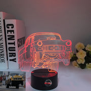 1955 Chevy 3D LED Illusion Lamp showing the classic Tri-Five silhouette in a vibrant teal glow on a premium black base.