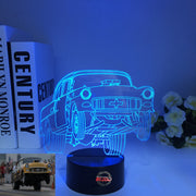 1955 Chevy 3D LED Illusion Lamp showing the classic Tri-Five silhouette in a vibrant teal glow on a premium black base.