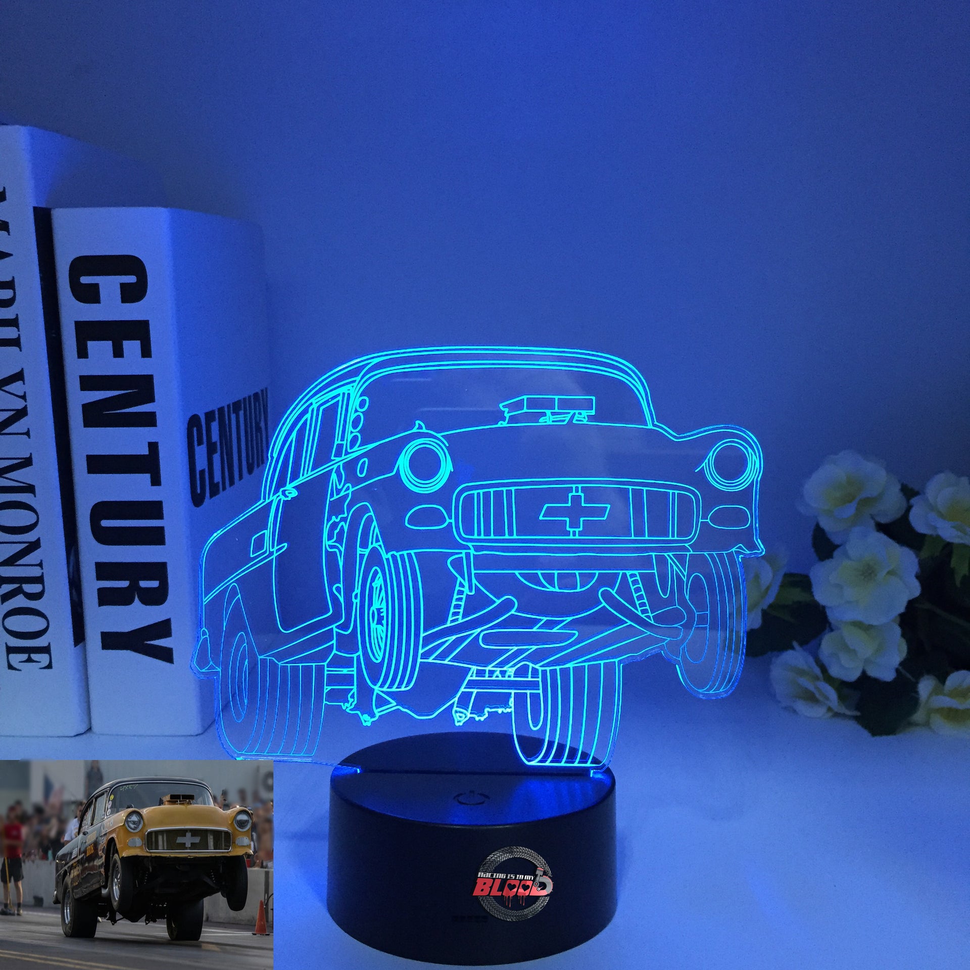 1955 Chevy 3D LED Illusion Lamp showing the classic Tri-Five silhouette in a vibrant teal glow on a premium black base.