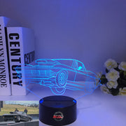 1963 Corvette C2 3D LED Illusion Lamp showing the classic Sting Ray silhouette in a vibrant blue glow on a premium black base.