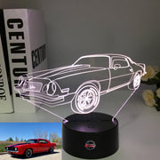 1969 Camaro Z/28 3D LED Illusion Lamp showing the classic muscle car silhouette in a vibrant red glow on a premium black base.