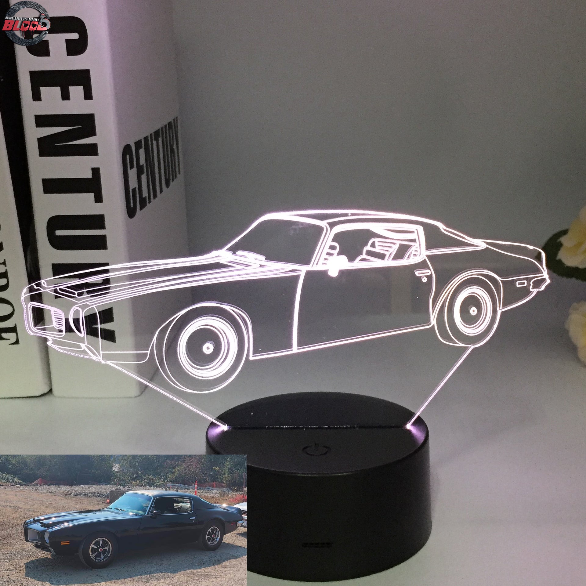 1970 Pontiac Firebird 3D LED Illusion Lamp displaying the classic second-generation silhouette in a vibrant red glow on a premium black base.