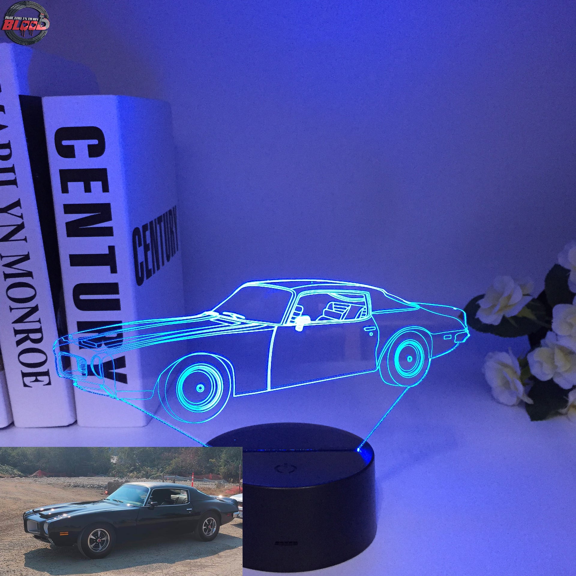 1970 Pontiac Firebird 3D LED Illusion Lamp displaying the classic second-generation silhouette in a vibrant red glow on a premium black base.