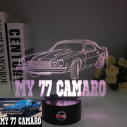 1977 Chevy Camaro 3D LED Illusion Lamp showing the classic second-generation silhouette in a vibrant yellow glow on a premium black base.