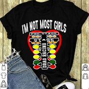 A bold and stylish apparel design featuring the text "I'm Not Most Girls" with drag racing graphics, printed on premium women's t-shirts, tanks, and hoodies.