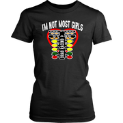A bold and stylish apparel design featuring the text "I'm Not Most Girls" with drag racing graphics, printed on premium women's t-shirts, tanks, and hoodies.