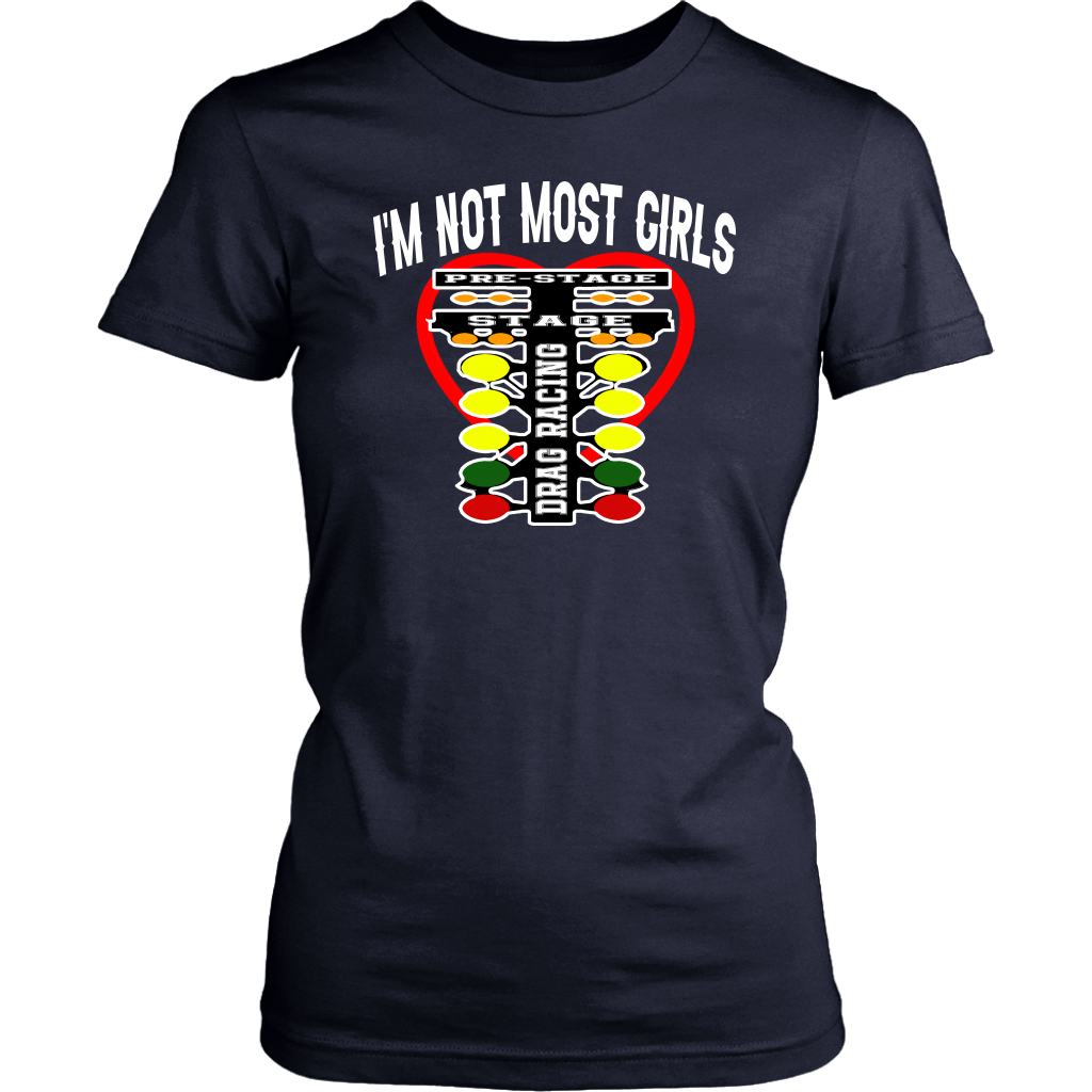 A bold and stylish apparel design featuring the text "I'm Not Most Girls" with drag racing graphics, printed on premium women's t-shirts, tanks, and hoodies.