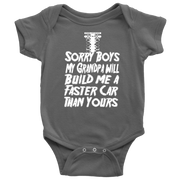 A cute and sassy kids' apparel design featuring the text "Sorry Boys My Grandpa Will Build Me A Faster Car Than Yours" with drag racing graphics, printed on high-quality baby bodysuits, toddler tees, and youth hoodies.
