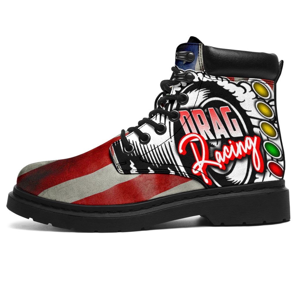 A pair of USA Drag Racing All-Season Boots featuring a bold, full-color drag racing design on high-quality water-resistant micro-suede with a heavy-duty black sole.