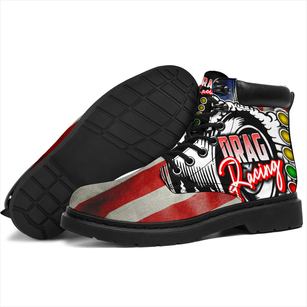 A pair of USA Drag Racing All-Season Boots featuring a bold, full-color drag racing design on high-quality water-resistant micro-suede with a heavy-duty black sole.