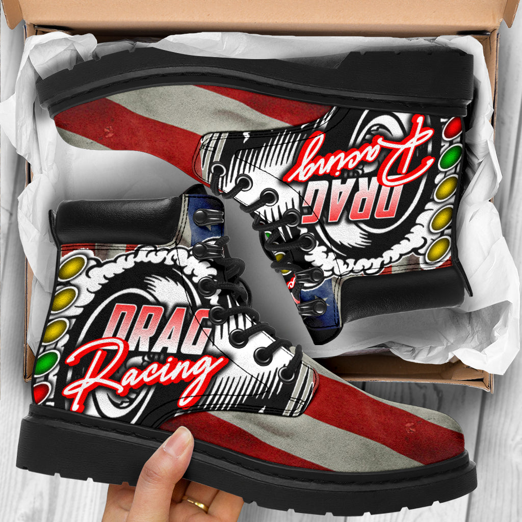 A pair of USA Drag Racing All-Season Boots featuring a bold, full-color drag racing design on high-quality water-resistant micro-suede with a heavy-duty black sole.