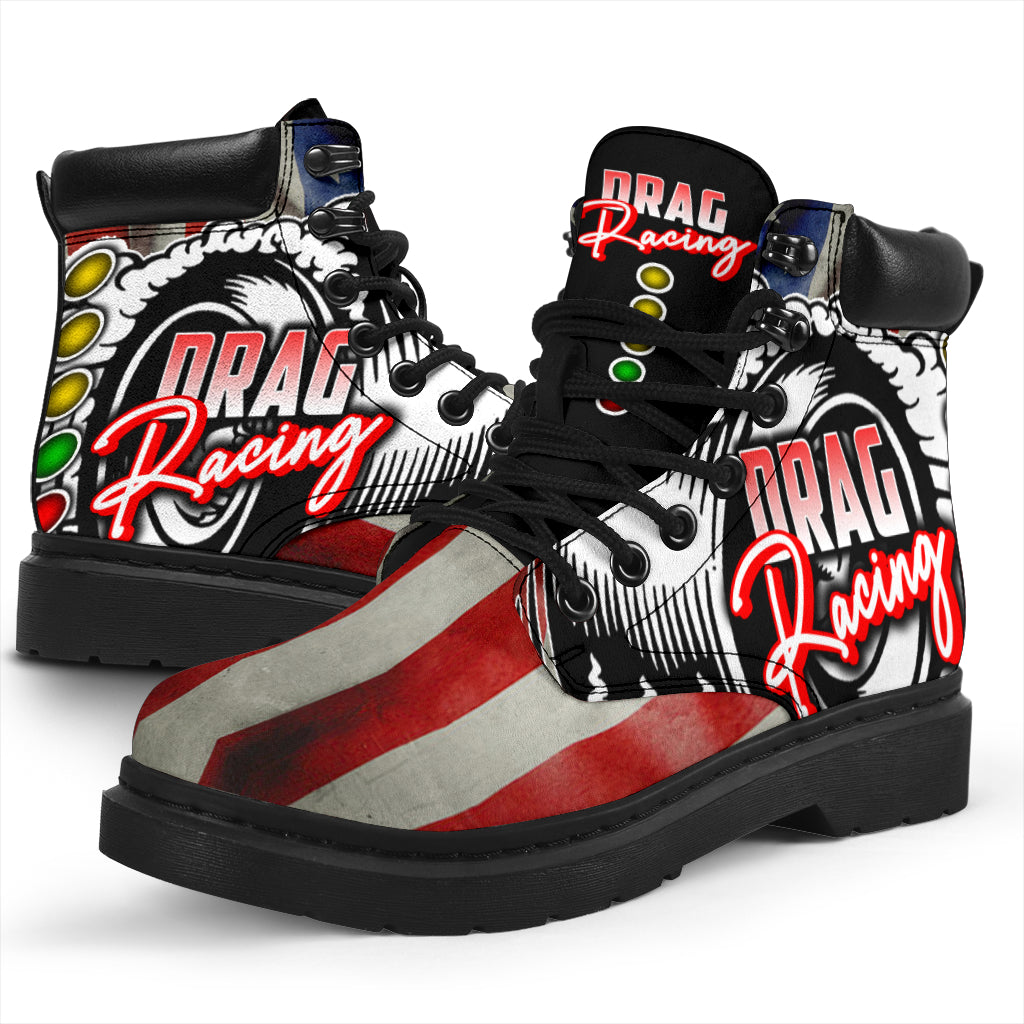 A pair of USA Drag Racing All-Season Boots featuring a bold, full-color drag racing design on high-quality water-resistant micro-suede with a heavy-duty black sole.