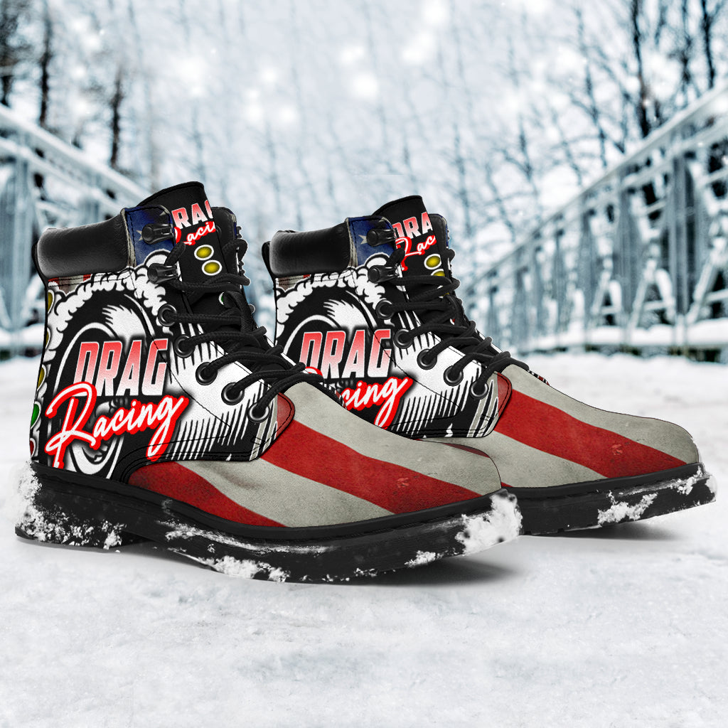 A pair of USA Drag Racing All-Season Boots featuring a bold, full-color drag racing design on high-quality water-resistant micro-suede with a heavy-duty black sole.